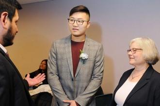 Newcomers HS winner Minghuang Wang and school counselor Marie Theodoropoulou tal