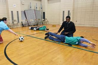 Students take a break from the braille activities to play goal ball, a Paralympi