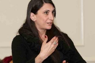 Gina Pilotti, a history teacher at Bronx Leadership Academy, poses a question to