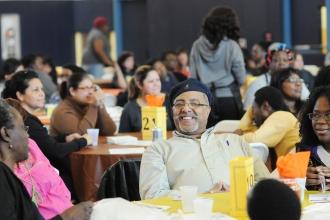 Parents listen appreciatively during the luncheon.