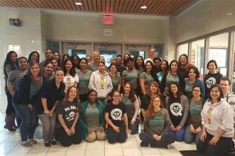 PS 330Q staff members come together to "teach, love and inspire" the school comm
