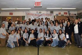 The staff of the East-West School of International Studies in Flushing celebrate