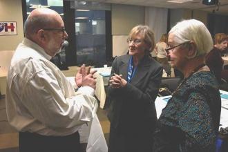 Keynote speaker Ron Janoff chats with guest Vassiliki Kekela and Ann Strimboules