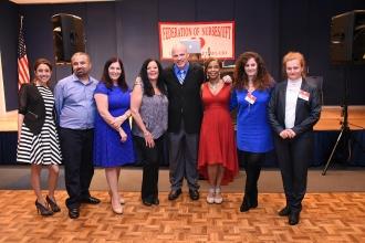 President Michael Mulgrew (fourth from right) and Anne Goldman (third from left)