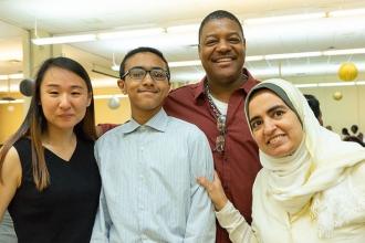 Scholarship winner Muhab Elkattawy (center) of Accion Academy poses with (from l