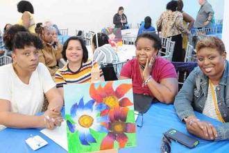 PS 36 members enjoy the event and the bright and beautiful “flowers” on their ta