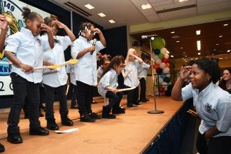 The PS 149 chorus performs under the direction of music teacher Will Mosely.