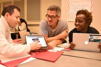 Paraprofessional Schneider Cardenas (left) of PS 196 in Brooklyn, teacher Fred W