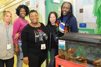 All smiles during the event are (from left) paraprofessional Lakisha Thompson, t