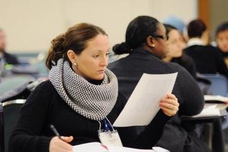 Brittany Klein, a teacher from Long Island, checks her notes.
