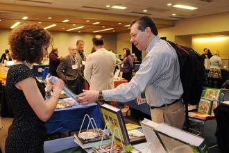 John Joyce, a teacher at Dewitt Clinton HS in the Bronx, looks over some books o