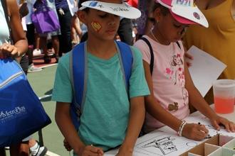 Children color at the crafts table. 