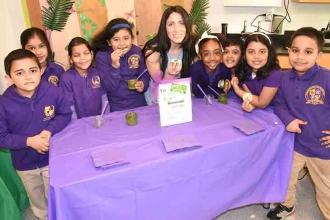 Students, joined by PS 349 Chapter Leader Farrah Padro, proudly serve guests the