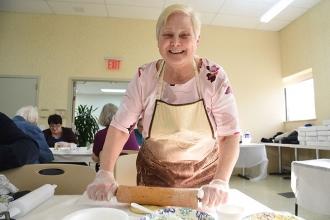 Retiree Stephanie Kollar rolls out the flour.