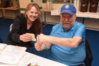 Sarah Evens of MS 172 in Queens breaks matzo with her dad, Marc Evens.