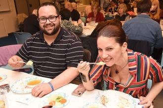 Smiling with their matzo ball soup are Manhattan educators Farrah Alexander of P