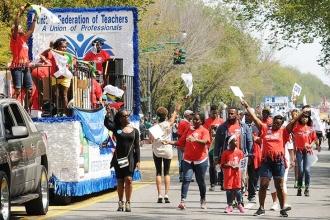 The UFT float keeps pace with the marchers.