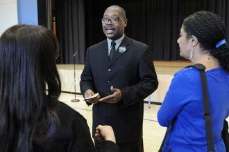 UFT Manhattan Borough Representative Dwayne Clark engages members.