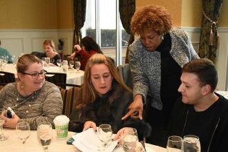  UFT Vice President Karen Alford (standing) hands out information about the UFT’