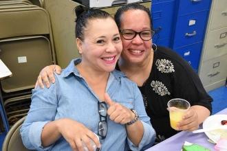 Among those at the meeting are Altagracia Hernandez (left), a 1st-grade teacher,