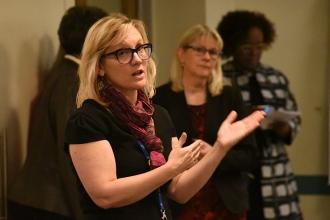 New lead teacher assistants listen to UFT personnel specialist Amy Arundell.