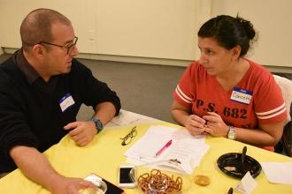 HS for Public Service teacher Garth Wolkoff chats with Concetta LaSpisa, a lead 