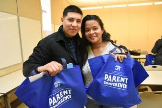 Parents Andres and Kylin Barraza show off their swag bags.