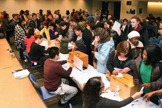 VNS members cast their votes for the contract. Only three people voted against r