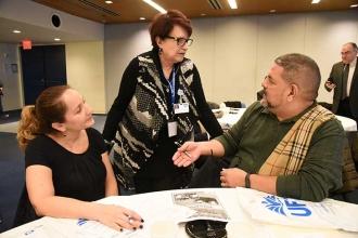 UFT School Secretaries Chapter Leader Mona Gonzalez (standing) chats with Wanda 