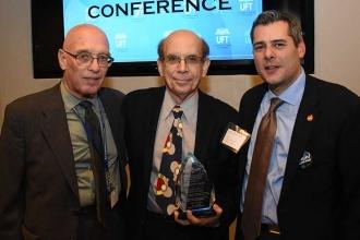 Dr. Jack Zevin (center) receives the Presidents Award from Robert Dytell (left) 