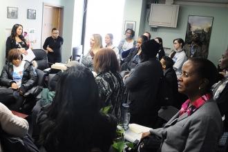 District 4 members chat with a staffer in the office of State Sen. Jose Serrano,