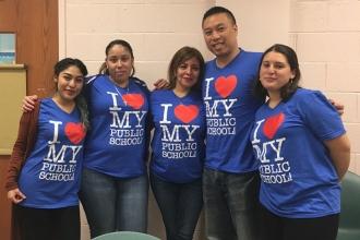 Paraprofessionals show love for public schools at PS 152 in Woodside, Queens.