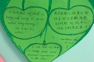 A parent shows love for a District 24 pre-K center in Queens.