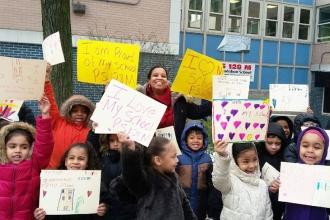 Students rallied to show love for their school at PS 128 in Washington Heights.