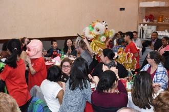 Students from PS 124 in Chinatown perform the lion dance in costume and accept d