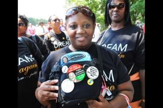 Cathy London, a teacher at PS 40 in Queens, displays the March on Washington 20t