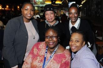 UFT District 16 Representative Camille Eaddy (standing, right) with members from