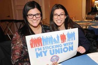 Lauren Minichello (left) and Jacquelyn Violetta, teachers at PS 6, show how they