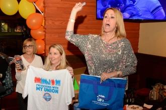 Mimi Carroll (center), the chapter leader and math coach at PS 200, displays the