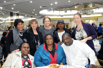 Staff members from PS 156 in Laurelton wait to hear Mulgrew speak.