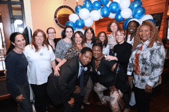 Educators from District 18 arrive in a festive mood for the late afternoon event