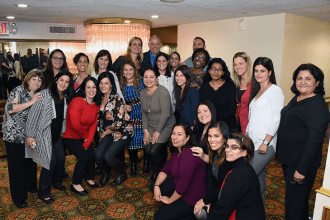 Educators pose with UFT President Michael Mulgrew (center, back) after the event