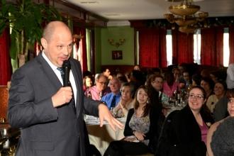 An attentive audience listens to the union president.