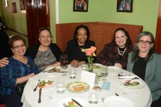 School secretaries get together with Assistant Treasurer Mona Romain (center).