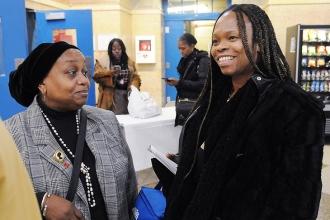 Sharmaine Walker (right), a paraprofessional at Hudson HS of Learning Technologi