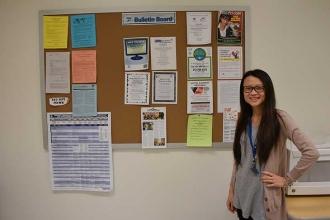 Chapter leader Anna Chen shows off her UFT bulletin board