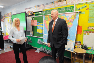 A 6th-grade teacher welcomes Mulgrew to her classroom.