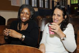 Teachers Althea Eboh (left) and Jacqueline Mateo await the start of the meeting.