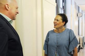 NYC iSchool counselor Lizzette Colon chats with Mulgrew as he does a walk-throug