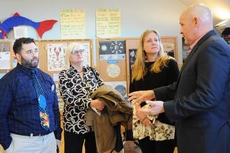 Chatting with Michael Mulgrew after the meeting are Gary DiFranco (left) and Mar